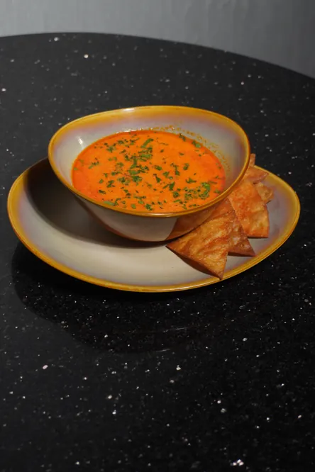 Caldo de queso with crisp tortilla wedges
