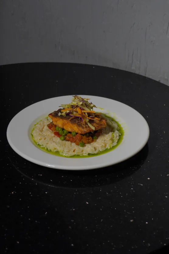 Sea bass a la Bilbaina on herb salsa verde