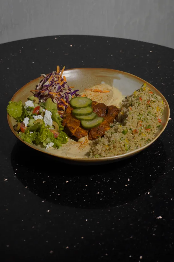 Chicken souvlaki bowl with herbed rice and slaw
