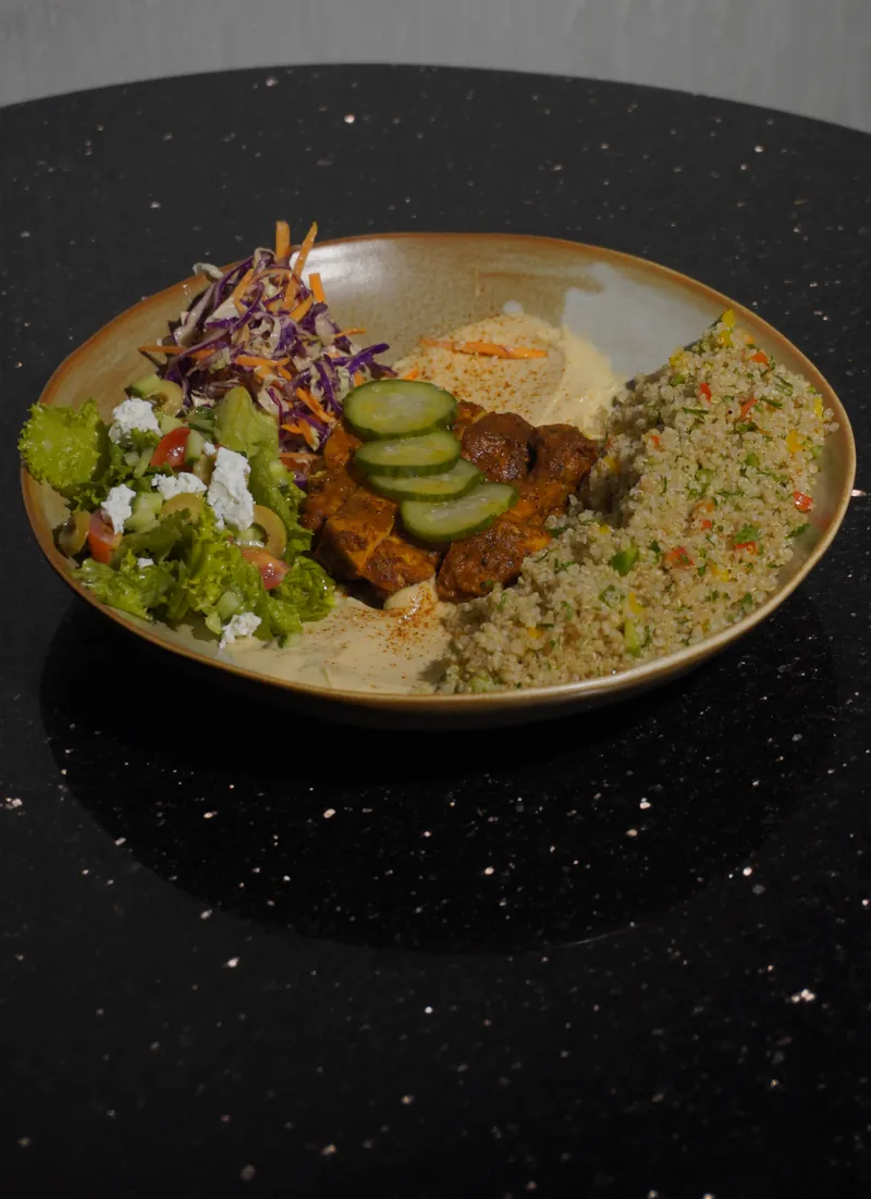 Chicken souvlaki bowl with herbed rice, cucumber and pickled slaw